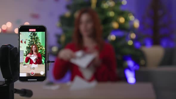 Diy New Year Blogger with Scissors Shows How to Cut Snowflake Out of Paper for Christmas Decor in alt