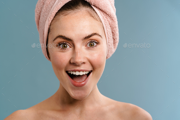 Delighted Shirtless Girl In Towel Posing And Smiling On Camera Stock