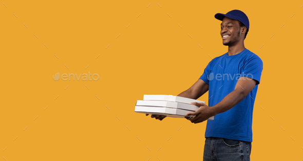 Black Delivery Man Holding Pizza Boxes Giving It To Copyspace Stock Photo By Prostock Studio