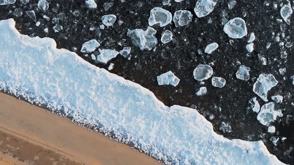 Top Aerial View From Above. A Beautiful Designer View of the Banks of the Freezing River. The Sandy alt