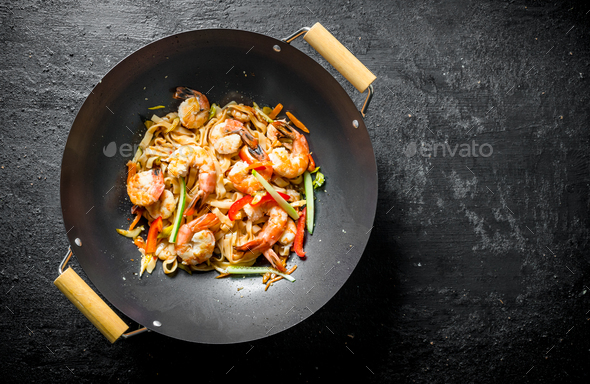 Chinese wok. Asian Udon noodles with shrimp and vegetables. Stock Photo ...