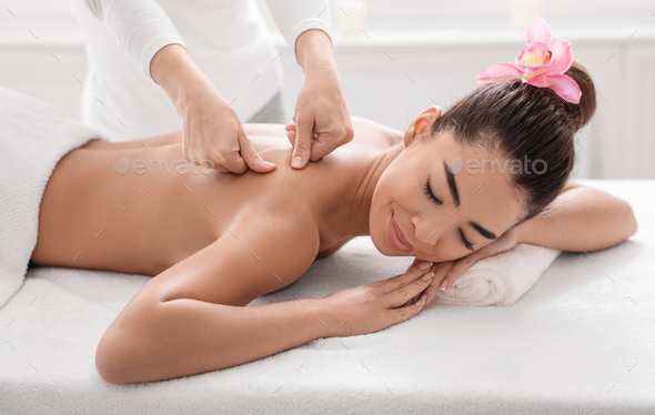 Shoulder and Neck Massage for Woman in Spa Salon. Stock Image