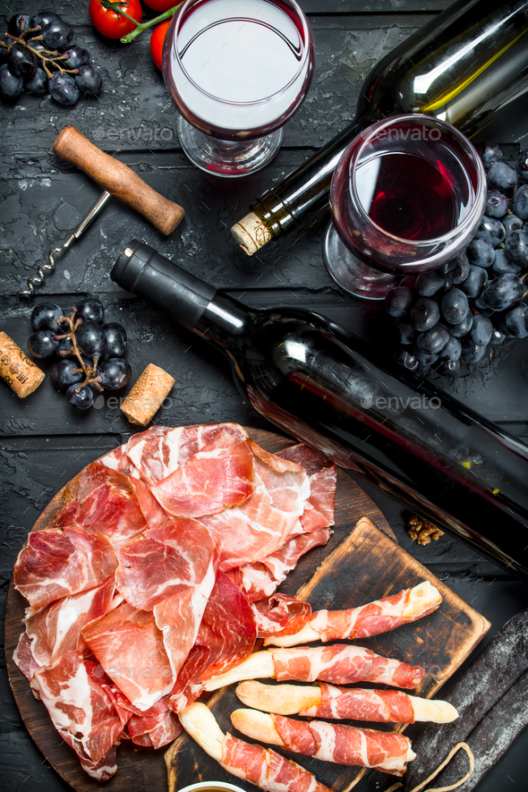 Antipasto background.Traditional Italian appetizers with red wine. Stock Photo by Artem_ka2