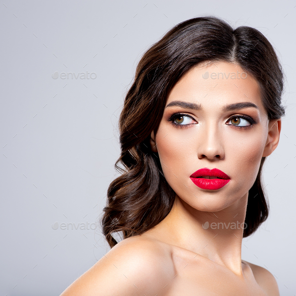 Beautiful young fashion woman with red lipstick. Brunette woman
