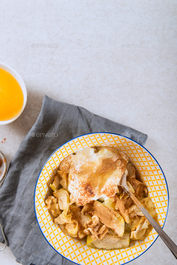 Stewed Apple with Cinnamon, baked in the oven and topped with wa - Stock Photo - Images