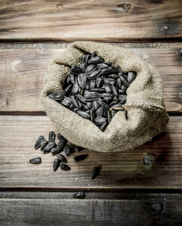 Sunflower seeds in a bag. Stock Photo by Artem_ka2 PhotoDune
