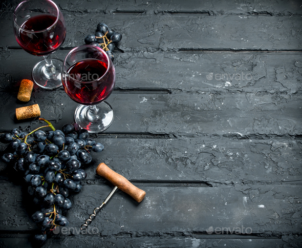 Wine background. Red wine with grapes and corkscrew. Stock Photo by  Artem_ka2