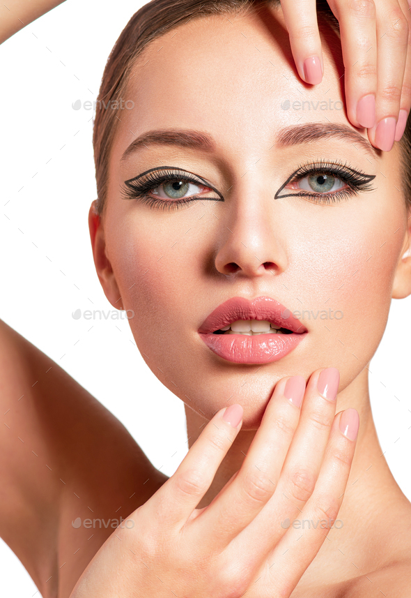 Beautiful girl with makeup in the form of arrows. - Stock Photo - Images