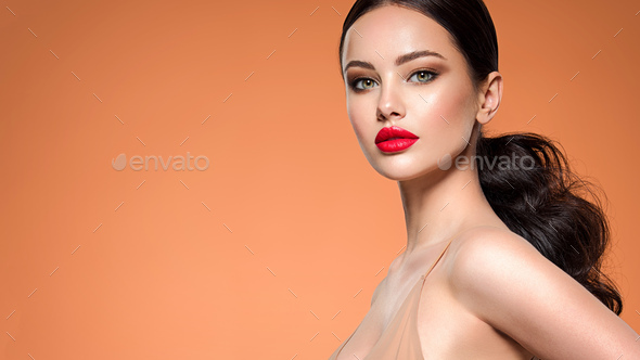 Beautiful white girl with a red lipstick on lips. Stunning brunette girl with long black hair. - Stock Photo - Images