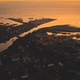 Sunset over sea bay at pier city aerial. Tropic cityscape on river banks at summer sun set light - PhotoDune Item for Sale