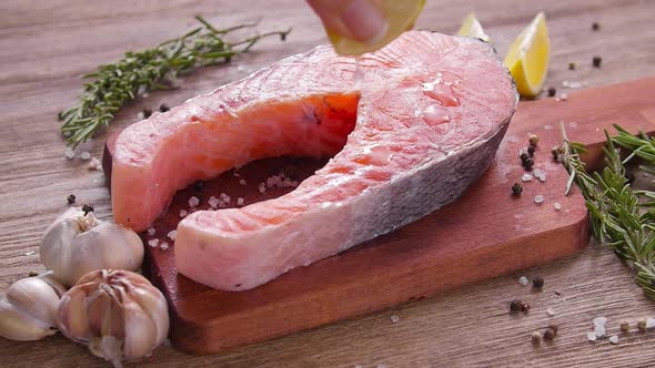 Raw, Fresh Salmon Steak on a Slate Board and Spices Around. Healthy Food Concept alt