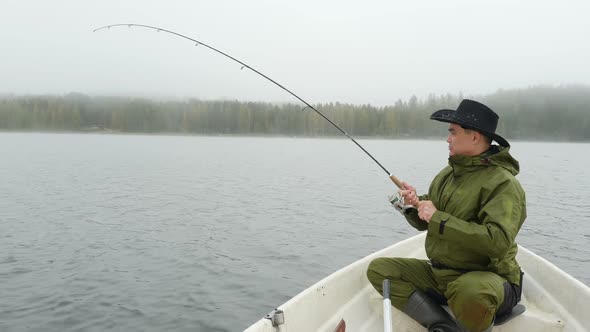 Man Fishing with Reel Rod