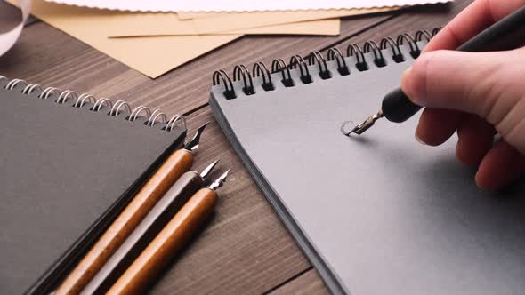 Anonymous Person Drawing Heart with Wings alt