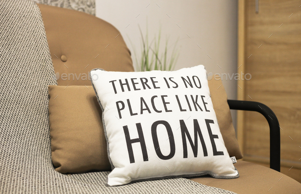 Cushions with a text There is no place like home. Stay home, quarantine concept.