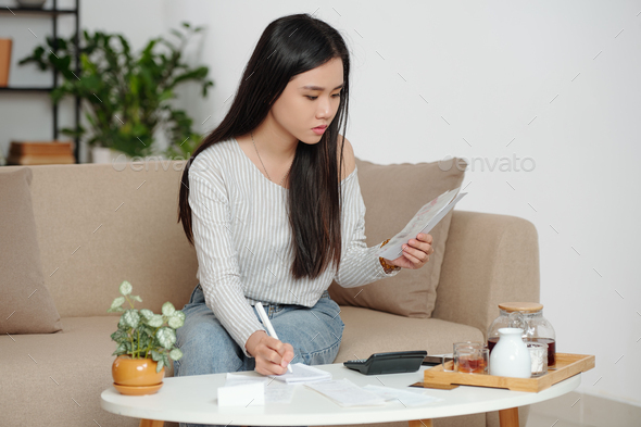 Woman calculating rent payments