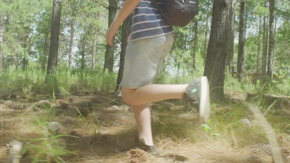 Boy running in woods