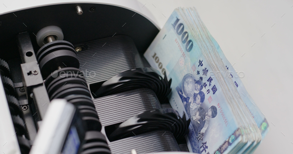 Money counter machine counting New Taiwan dollar