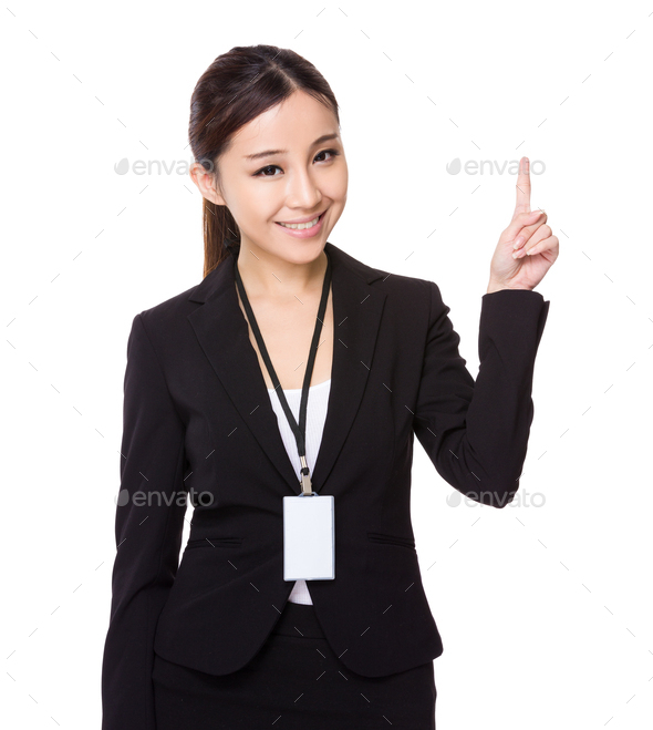 Asian young businesswoman hold wih name badge and finger point up