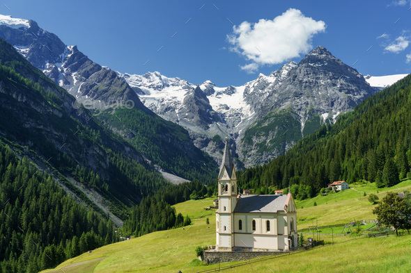 Mountain landscape along the road to Stelvio pass at summer. Church