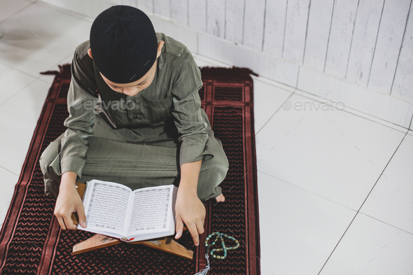 Muslim Boy Reading Holy Quran Stock Photo By Garakta Studio Photodune