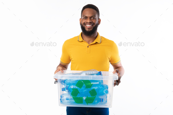 Black Guy Holding Box With Recycle Symbol On White Background
