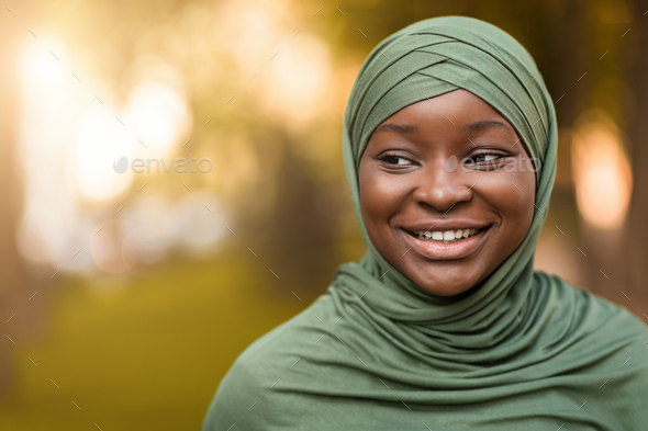 Beautiful Black Islamic Lady In Hijab Standing Outdoors And Looking