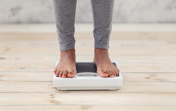Woman Weight Loss. Smiling Woman Standing On Scale. Woman Measuring Body  Weight On Weighing Scale. Weight Loss, Diet And Dieting, Healthy Lifestyle  Concept Photos