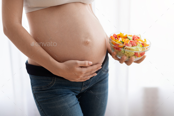 Eating Pregnant Belly Nude - Nutrition For Healthy Pregnancy. Pregnant Woman Holding Vegetable Salad  Bowl Near Belly Stock Photo by Prostock-studio
