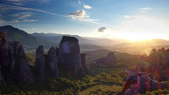 Astonishing View of Meteora Valley at Sunset Rays Running Across Rocks and Over Rousanou Nunnery and