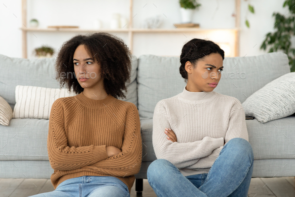 Quarrel of friends, problems and resentment. Angry and mad two millennial african american ladies
