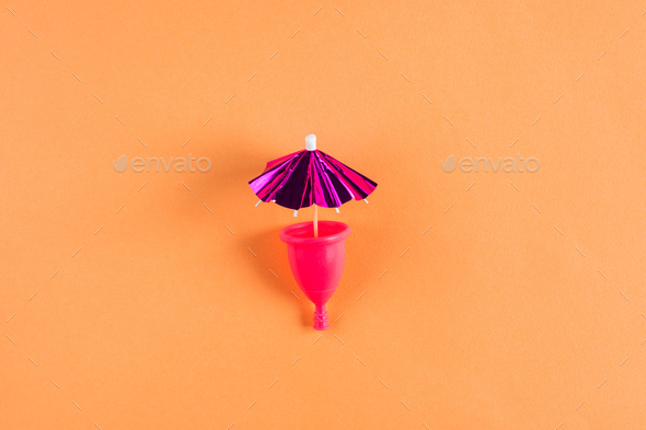Pink menstrual cup. Menstruation concept - Stock Photo - Images