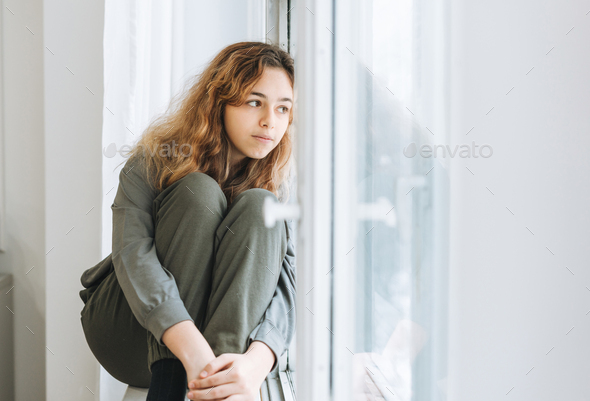 Awesome beauty teenager Beautiful Teenager Girl With Curly Hair Sitting On Window Sill Stock Photo By Galinkazhi