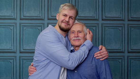 Happy Excited Young Man Embracing Grayhaired Old Dad or Grandfather Male Generations Family alt