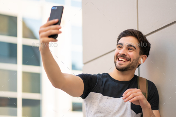 Young man having a video call on mobile phone.