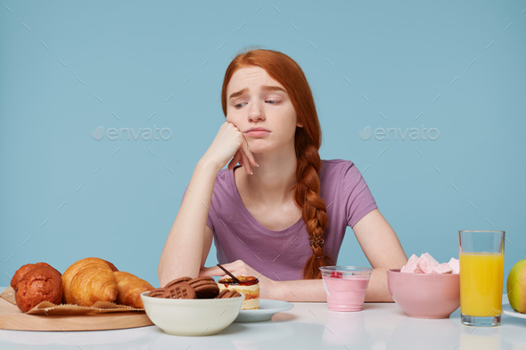 Red Haired Girl Looking With Sadness Discontent On Baking Products