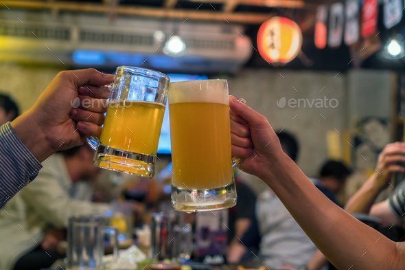 Two Glasses Of Beer Cheers Together Between Friend In The Bar And Restaurant Stock Photo By Thananit S
