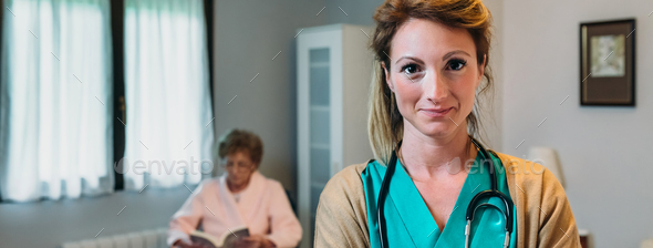 Pretty female doctor posing in a geriatric clinic - Stock Photo - Images