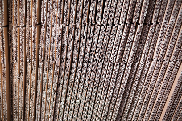 Close-up large cardboard piles lie on top Stock Photo by YouraPechkin