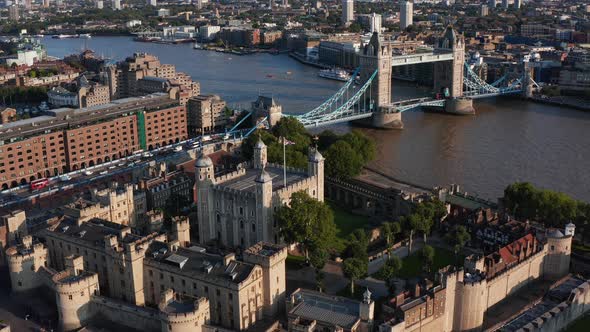 Aerial View of Medieval Royal Castle Tower of London and Tower Bridge Spanning River Thames alt