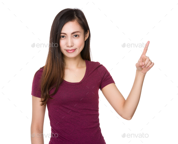 Young woman with finger point upwards