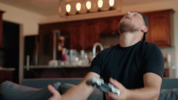 A Determined Male Gamer Who Experiences Emotional Stress When He Plays Video Games alt