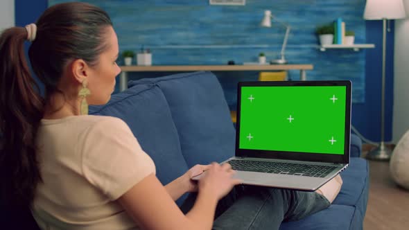 Back Shot of Caucasian Female Typing and Looking at Laptop Computer alt