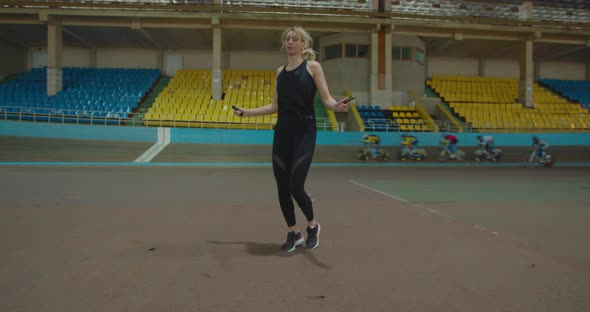 Skipping Woman Training at the Gym Working Out is Healthy Fitness Body alt