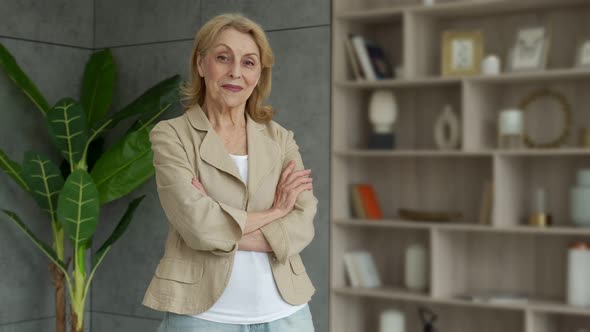 Happy Mature Business Lady of the 70s Standing in the Room alt