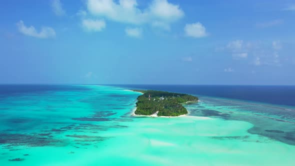 Wide angle above island view of a summer white paradise sand beach and aqua turquoise water alt