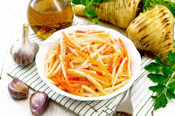 Salad of parsnip and carrot on napkin - Stock Photo - Images