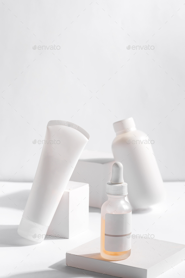 Set of cosmetic products in white containers on light background. Organic skincare