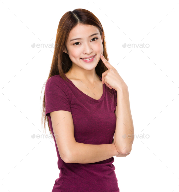 Asian woman finger point to her teeth