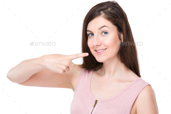 Woman with finger point to her teeth