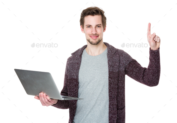 Man with notebook computer and finger point upwards